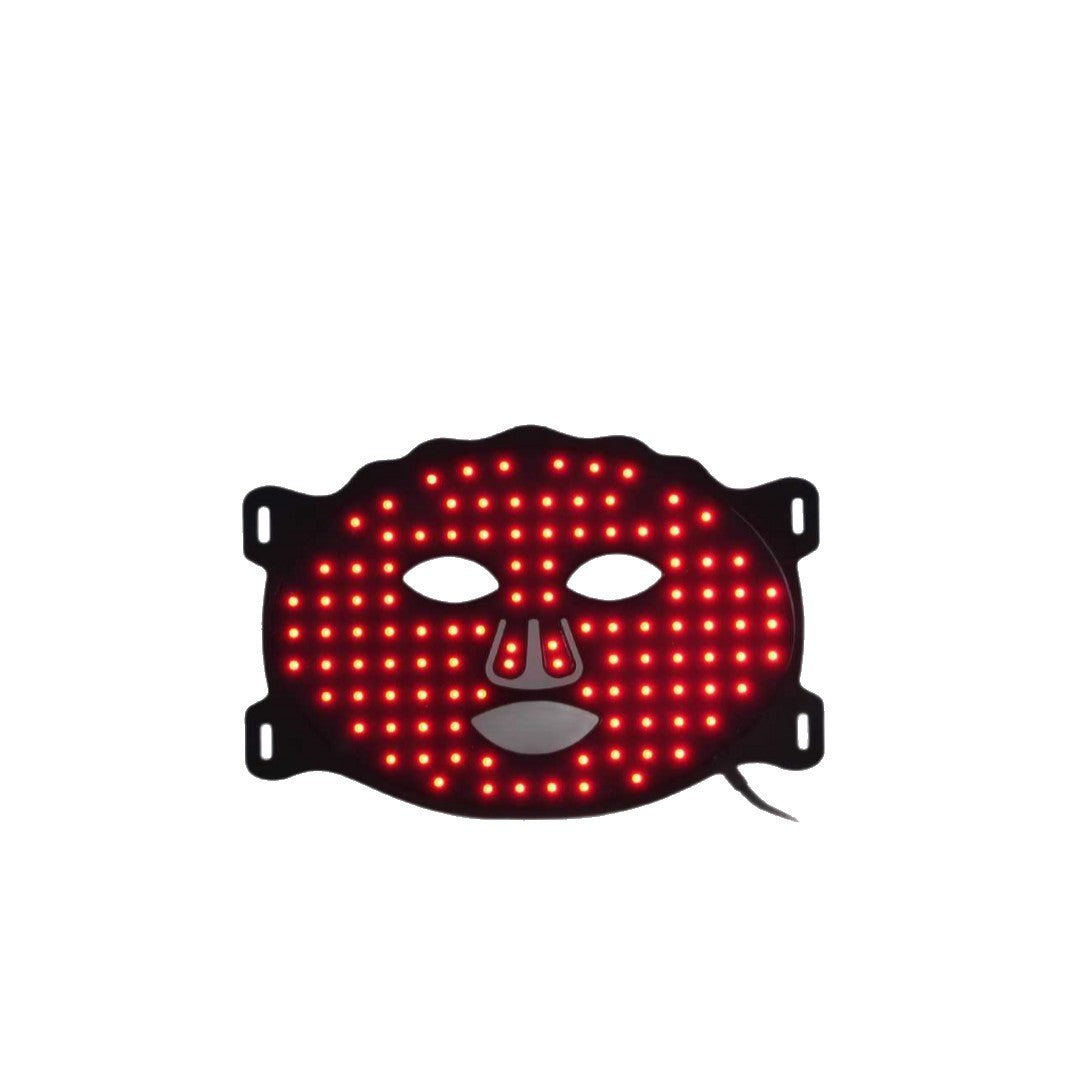 Velou Lumé™ LED Light Therapy Mask — lifestyle shot, woman wearing mask at home